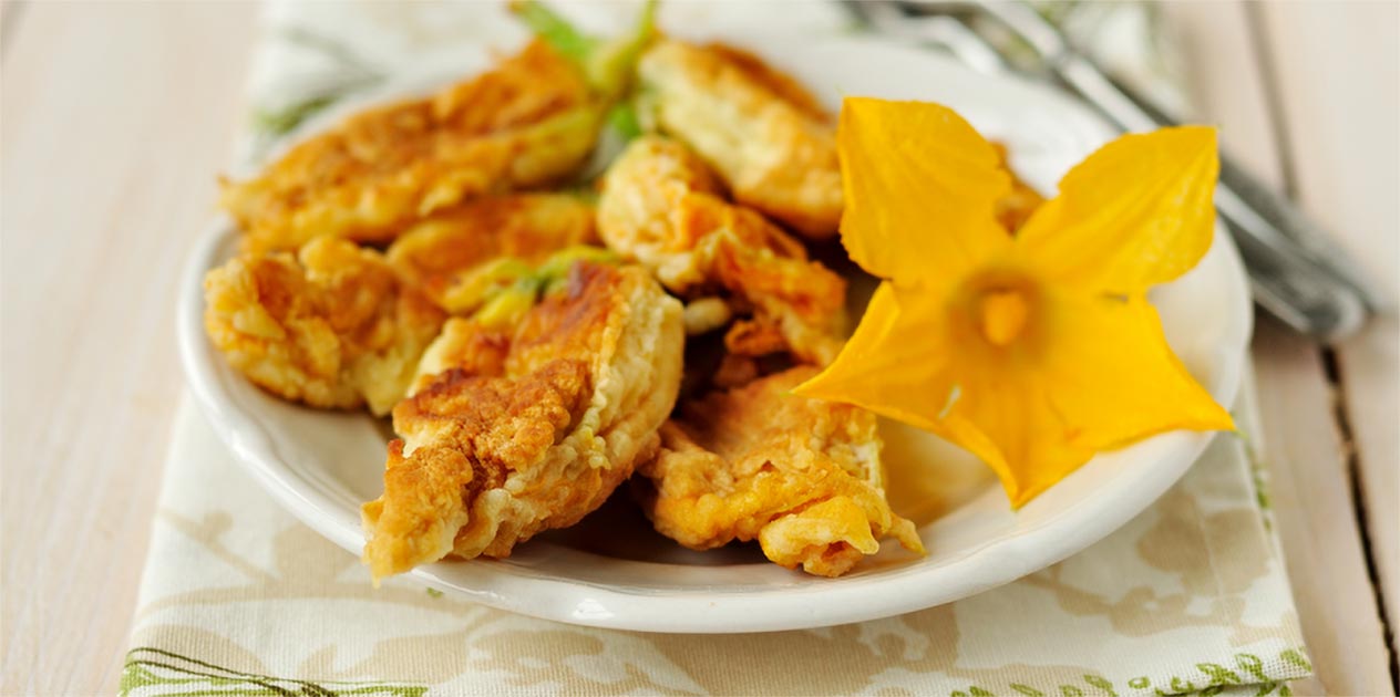 Photo of stuffed zucchini flower on a plate